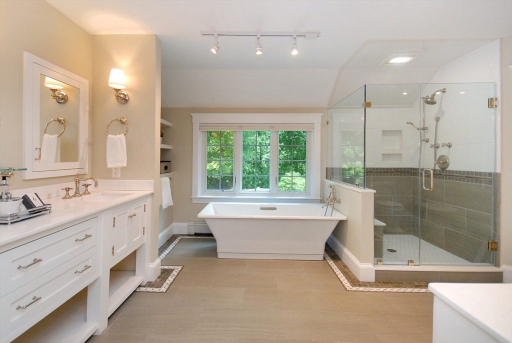 53 Sarah Way Concord, MA 01742 - Photo 24 of 42 a bathroom with a tub sink shower and mirror
