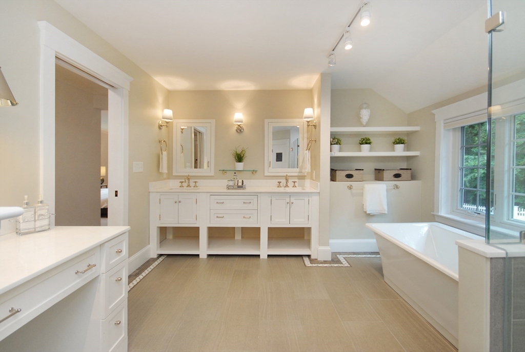 53 Sarah Way Concord, MA 01742 - Photo 26 of 42 a large white kitchen with a large window and furniture
