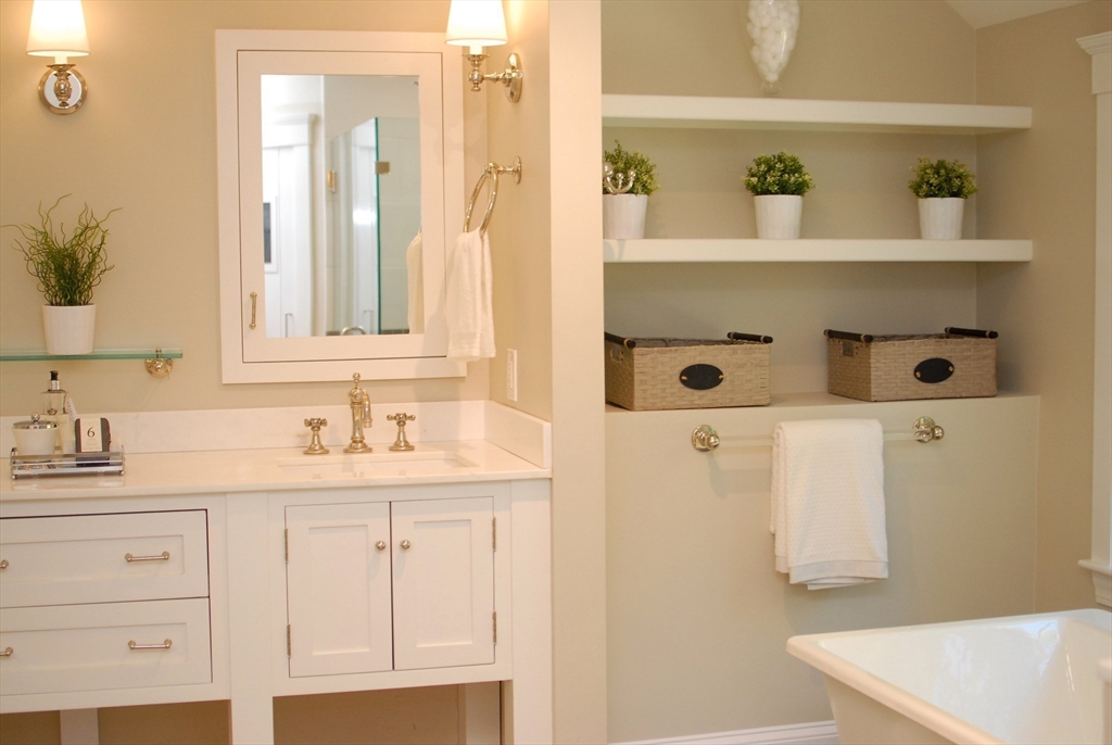 53 Sarah Way Concord, MA 01742 - Photo 27 of 42 a bathroom with a sink and a mirror
