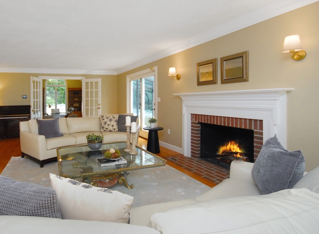 53 Sarah Way Concord, MA 01742 - Photo 3 of 42 a living room with furniture and a fireplace