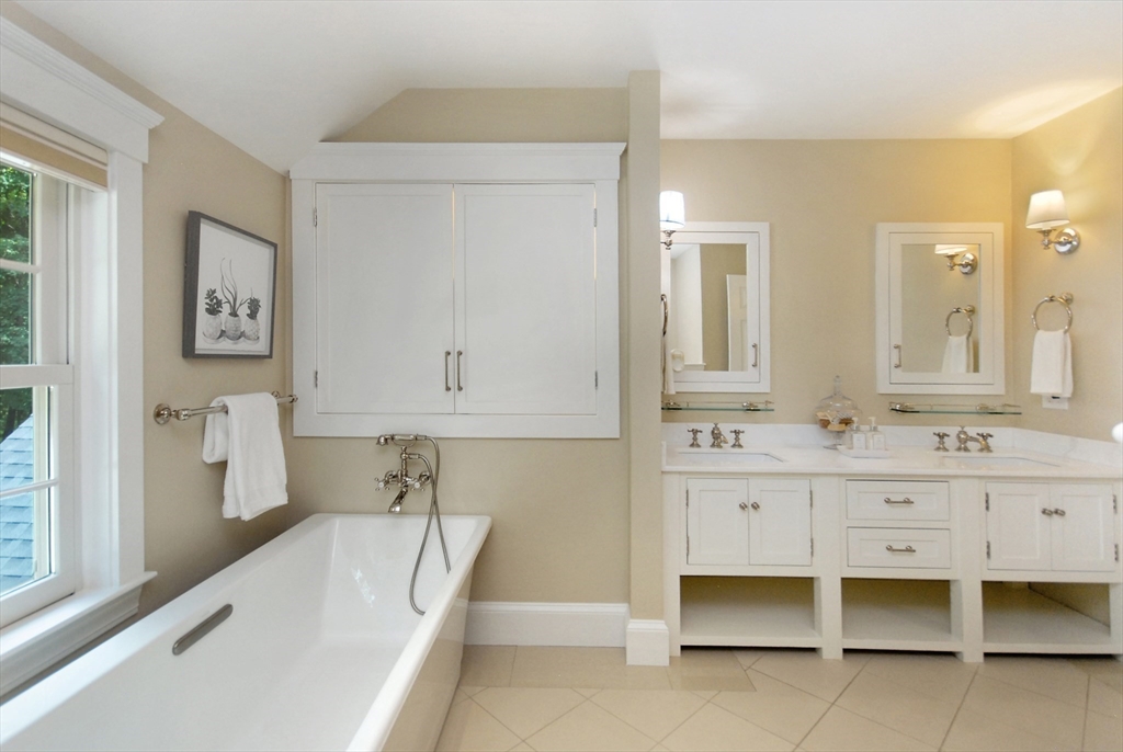 53 Sarah Way Concord, MA 01742 - Photo 31 of 42 a bathroom with a bathtub sink and mirror