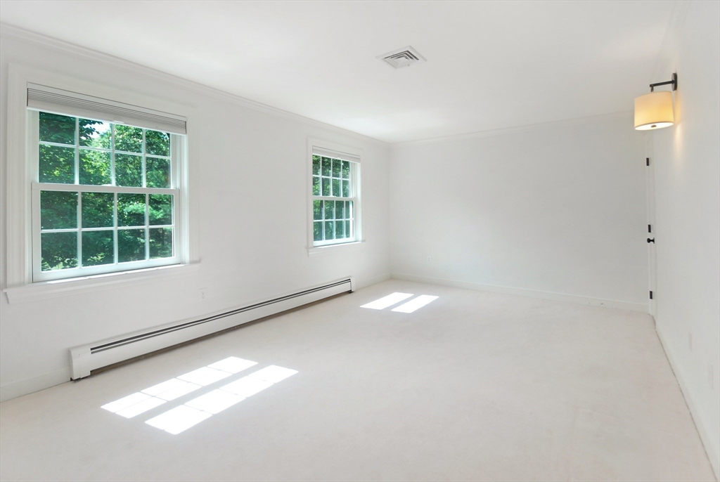 53 Sarah Way Concord, MA 01742 - Photo 32 of 42 a view of an empty room with a window