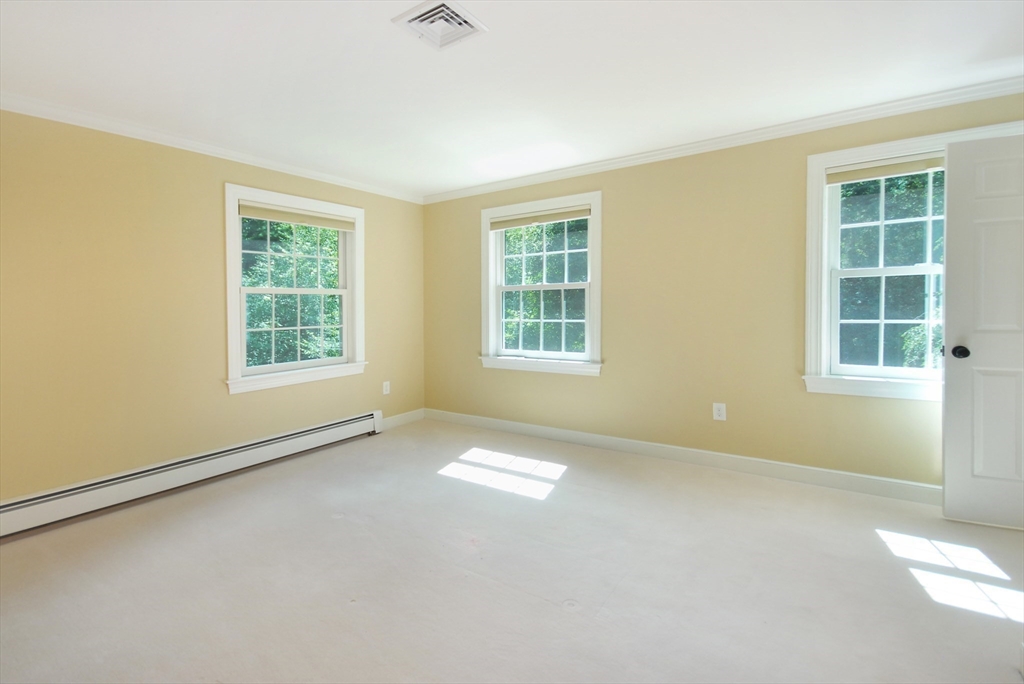 53 Sarah Way Concord, MA 01742 - Photo 33 of 42 an empty room with windows