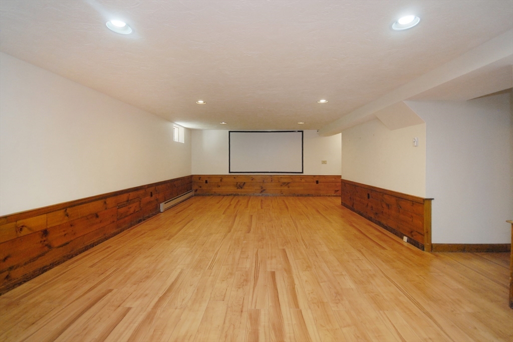 53 Sarah Way Concord, MA 01742 - Photo 35 of 42 a view of an empty room with wooden floor