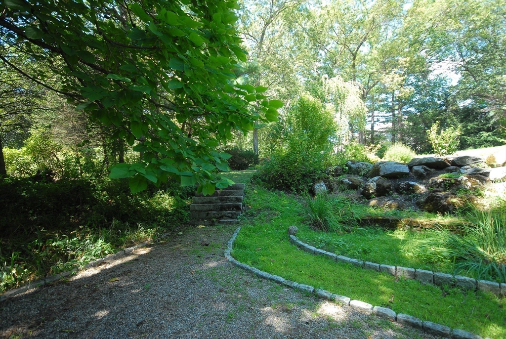 53 Sarah Way Concord, MA 01742 - Photo 36 of 42 a view of a street with a tree