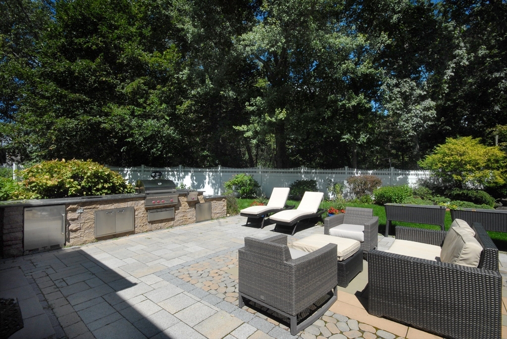 53 Sarah Way Concord, MA 01742 - Photo 40 of 42 a view of a patio with couches and potted plants