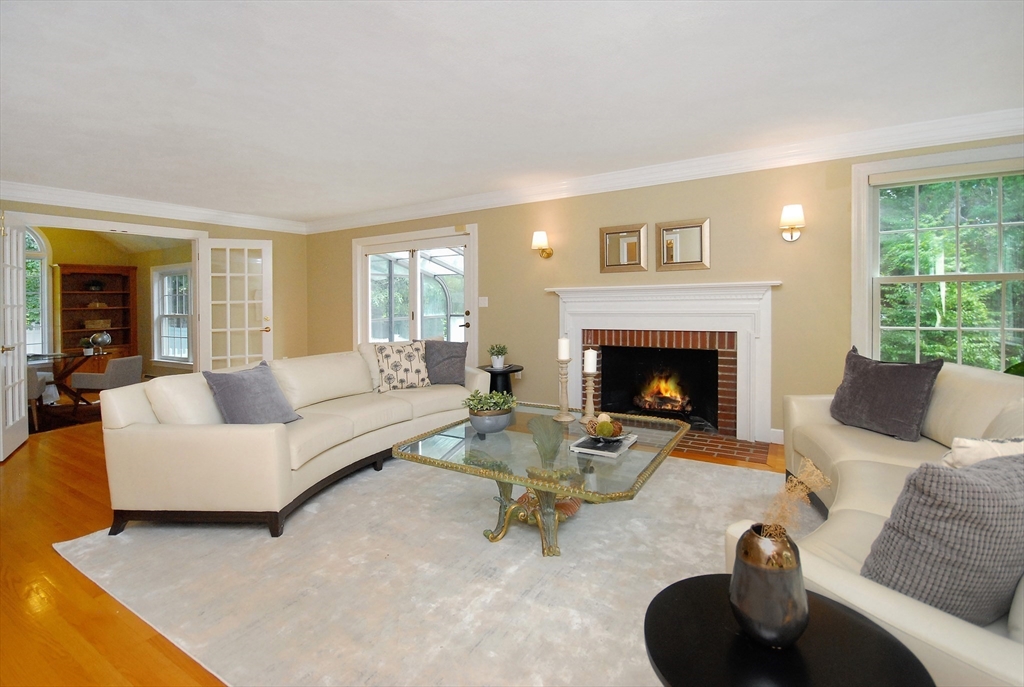 53 Sarah Way Concord, MA 01742 - Photo 4 of 42 a living room with furniture and a fireplace