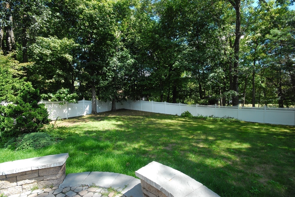 53 Sarah Way Concord, MA 01742 - Photo 42 of 42 a view of a backyard with a garden and trees