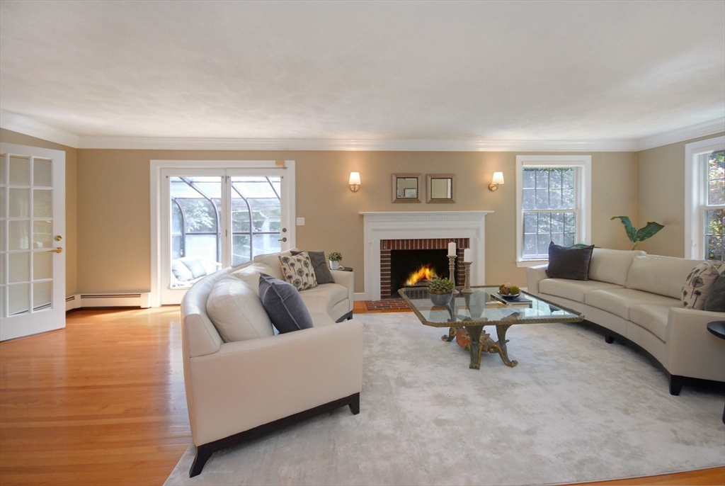 53 Sarah Way Concord, MA 01742 - Photo 5 of 42 a living room with furniture and a fireplace