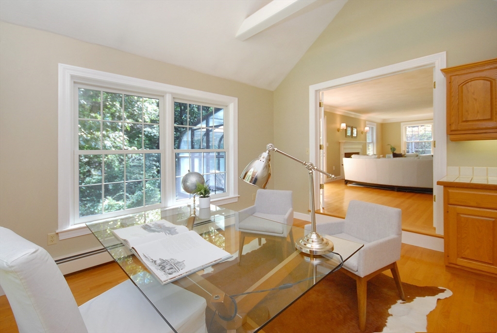53 Sarah Way Concord, MA 01742 - Photo 7 of 42 a living room with patio furniture and a large window