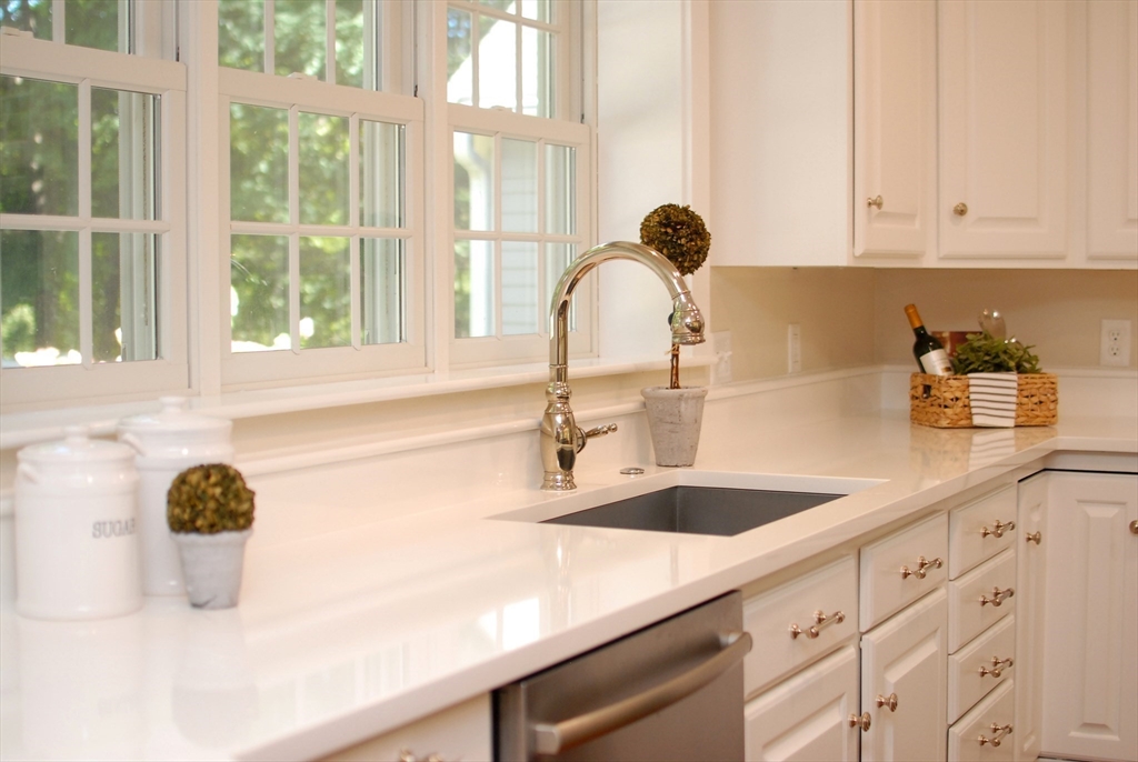 53 Sarah Way Concord, MA 01742 - Photo 10 of 42 a kitchen with a sink and a window
