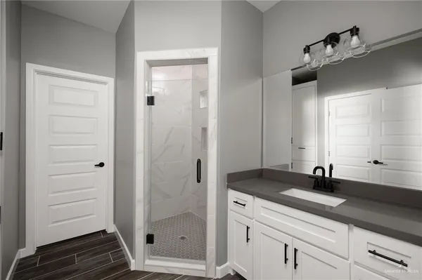 a bathroom with a sink and a mirror