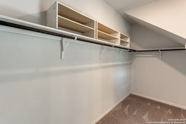 a view of a room with racks on the wall