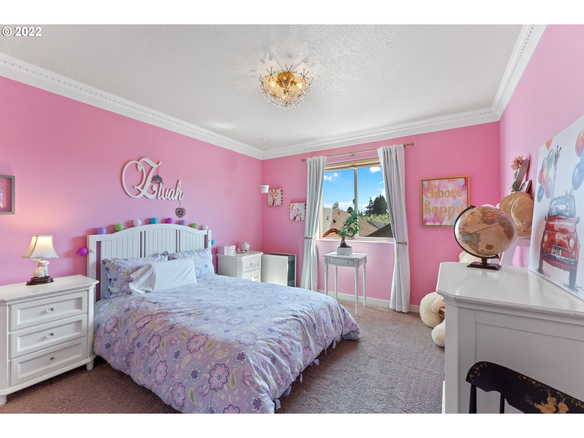 77 North 41st Place Ridgefield, WA 98642 - Photo 22 of 31 a bedroom with a bed and a chandelier