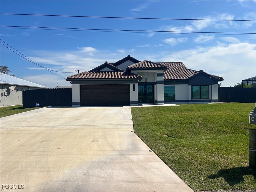 a front view of a house with a garden