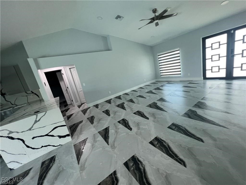 1215 Northwest 38th Avenue Cape Coral, FL 33993 - Photo 13 of 35 a view of a livingroom with wooden floor