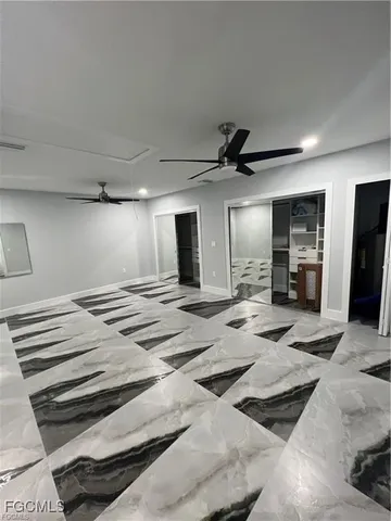 a view of a livingroom with furniture and a kitchen