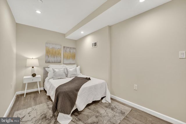 a bedroom with a bed and a table