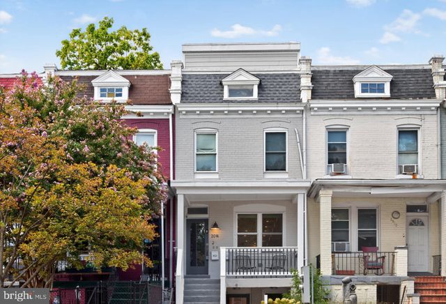 a view of balcony with an outdoor space and seating