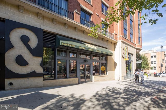 a view of a building with sitting area