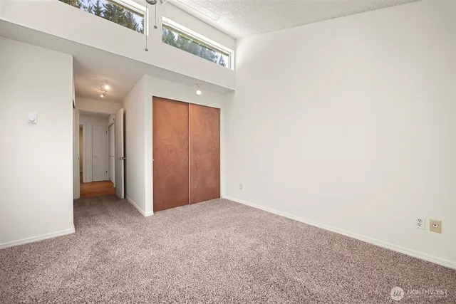 a view of a hallway with a chandelier