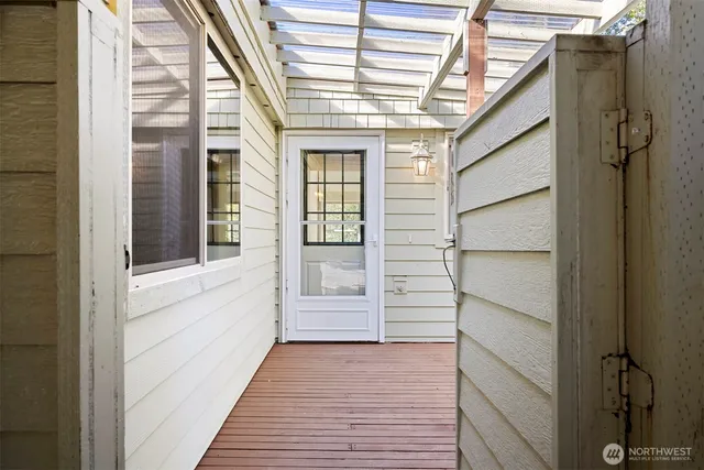 a view of a house with wooden deck