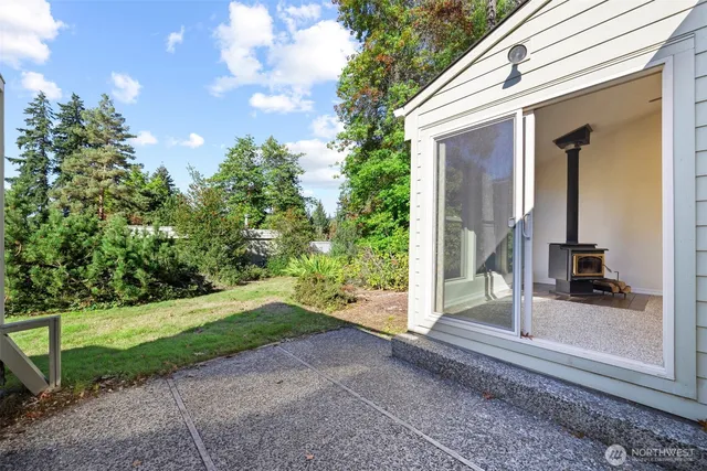 a view of a house with a backyard