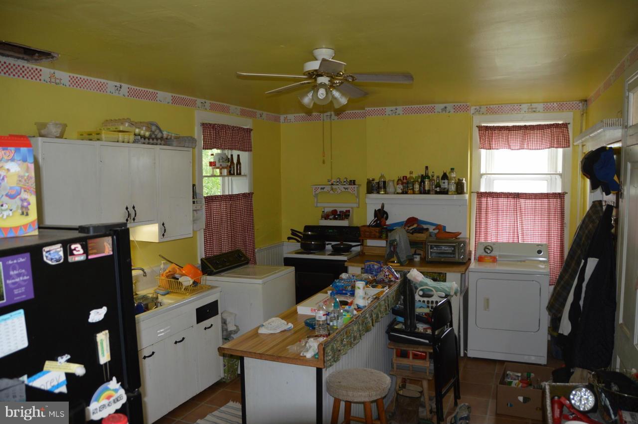 5219 Frock Road Taneytown, MD 21787 - Photo 11 of 17 a room with furniture a air conditioner vent and a window