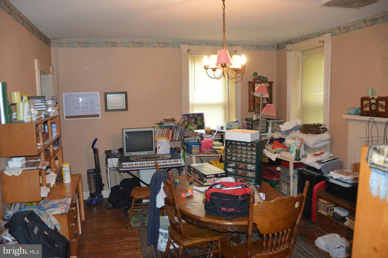 5219 Frock Road Taneytown, MD 21787 - Photo 12 of 17 a view of a dining room with furniture window and wooden floor