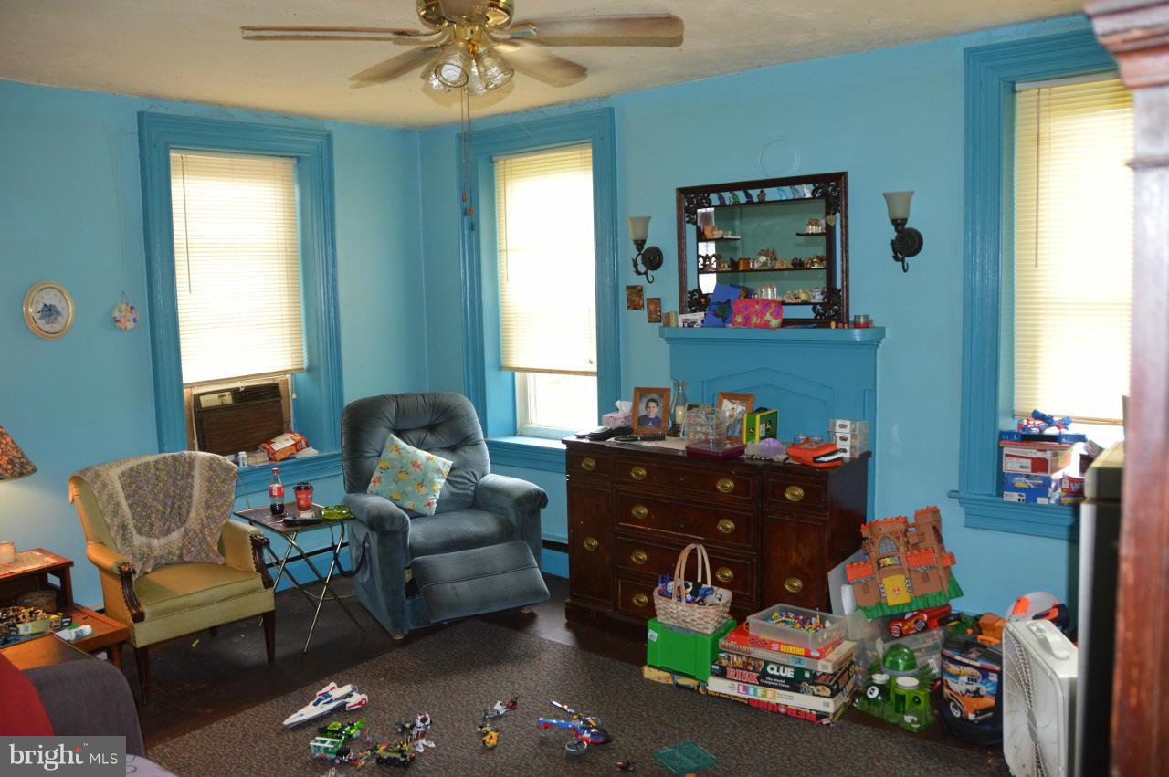 5219 Frock Road Taneytown, MD 21787 - Photo 13 of 17 a living room with furniture and a chandelier