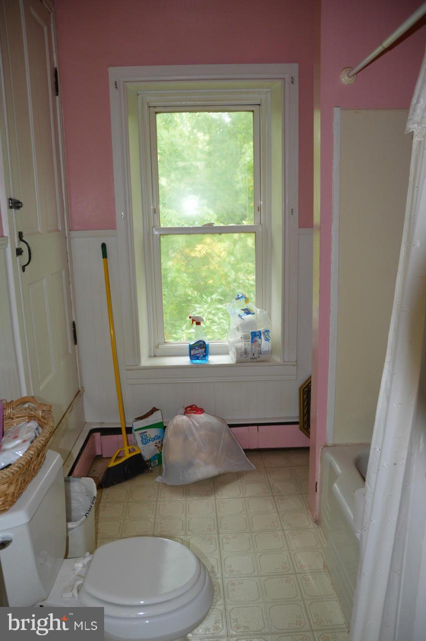 5219 Frock Road Taneytown, MD 21787 - Photo 14 of 17 a living room with furniture a window and a potted plant