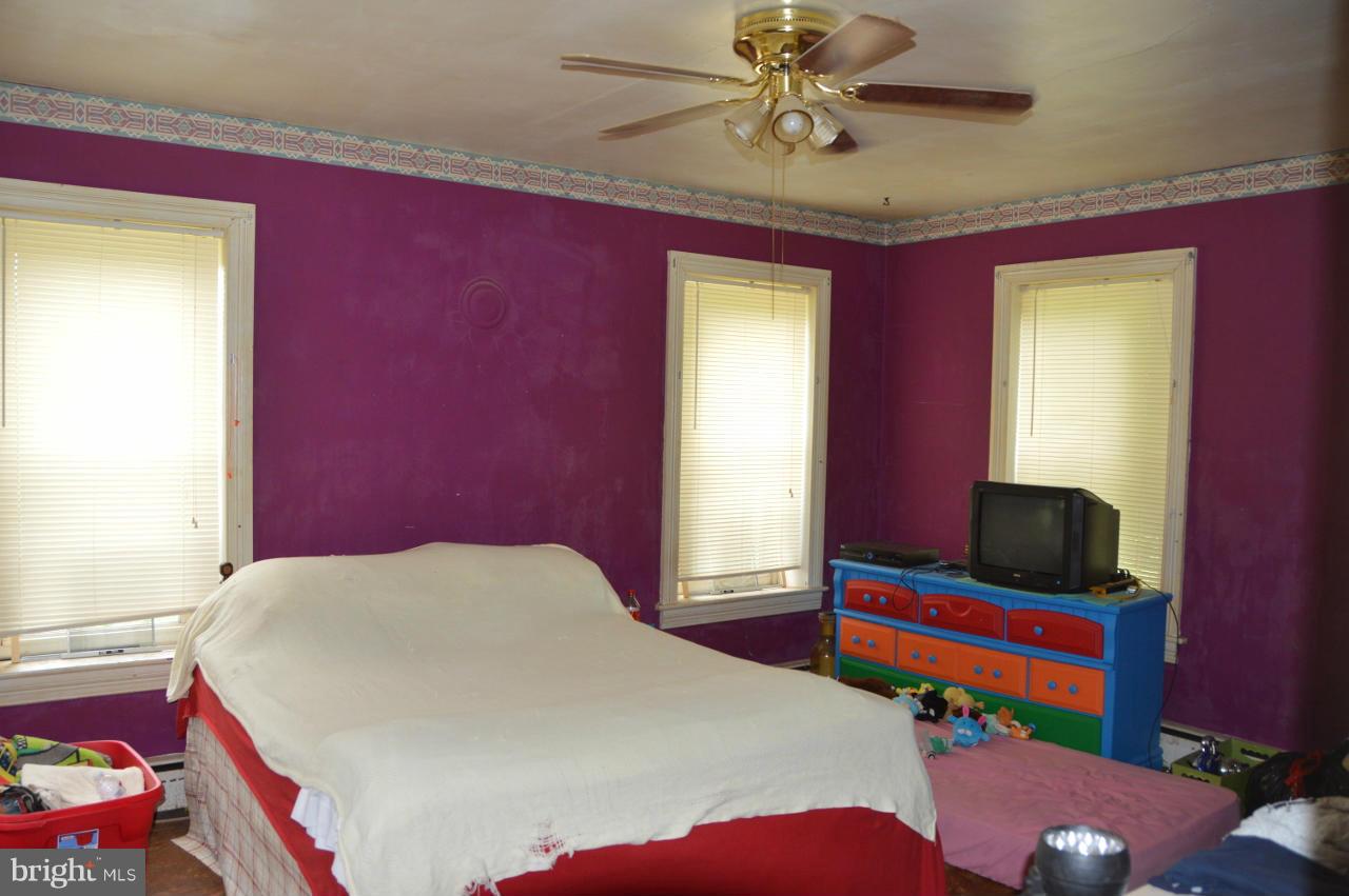 5219 Frock Road Taneytown, MD 21787 - Photo 15 of 17 a bedroom with a bed and a window