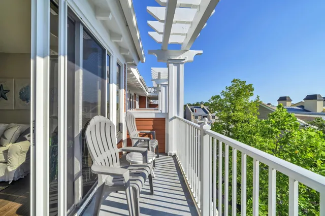 a view of a balcony with chairs