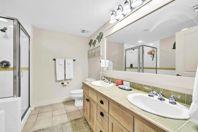 a bathroom with a double vanity sink and a mirror