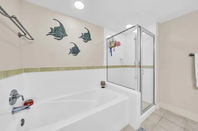 a bathroom with a bathtub and shower