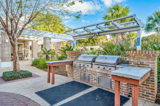 a view of a patio with a table chairs and a potted plant