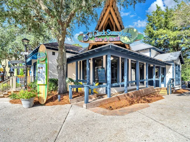 a view of tall building with large windows and a small yard