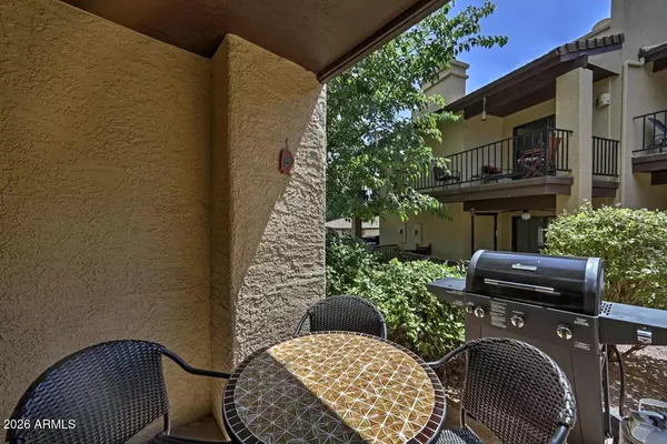 a view of balcony with outdoor seating and plants