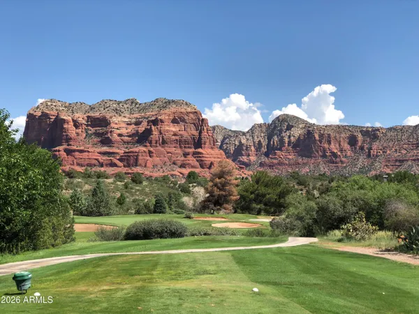 a view of a golf course with a lake