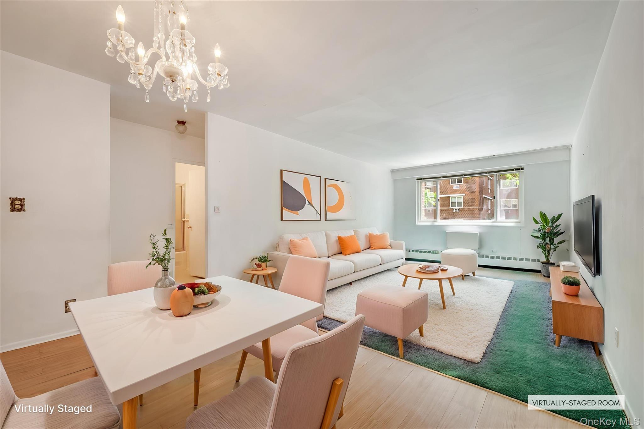 39-65 52nd Street, Unit 2H Queens, NY 11377 - Photo 1 of 18 a living room with furniture a chandelier and a dining table