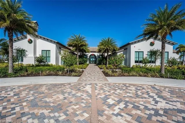 a view of a swimming pool with a patio and a garden