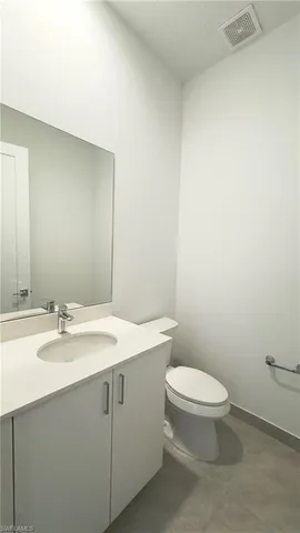 a view of a kitchen center island and windows in it