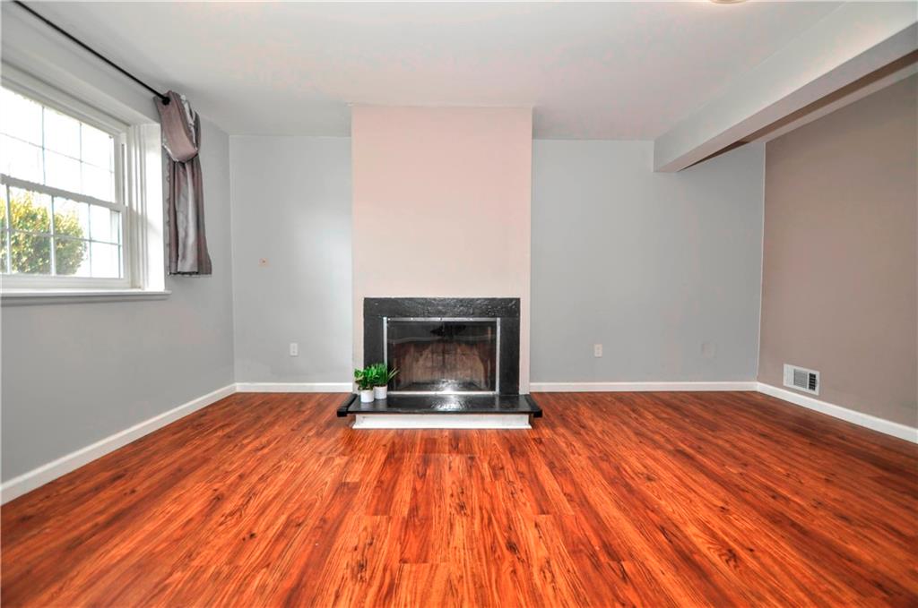 1313 Star Ridge Drive Pittsburgh, PA 15241 - Photo 30 of 36 a view of empty room with wooden floor and fireplace