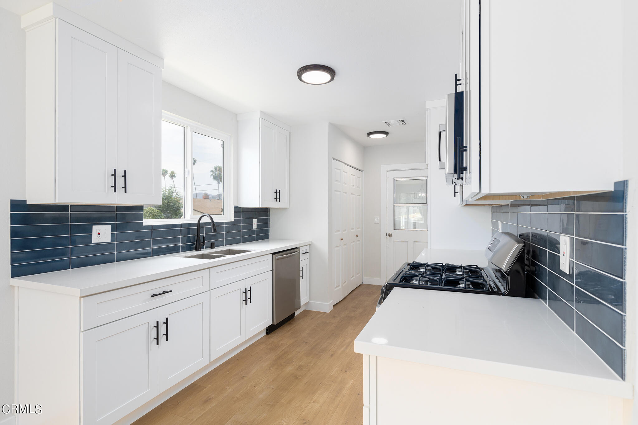 2485 Hanning Avenue Altadena, CA 91001 - Photo 11 of 36 a kitchen with sink a stove and cabinets