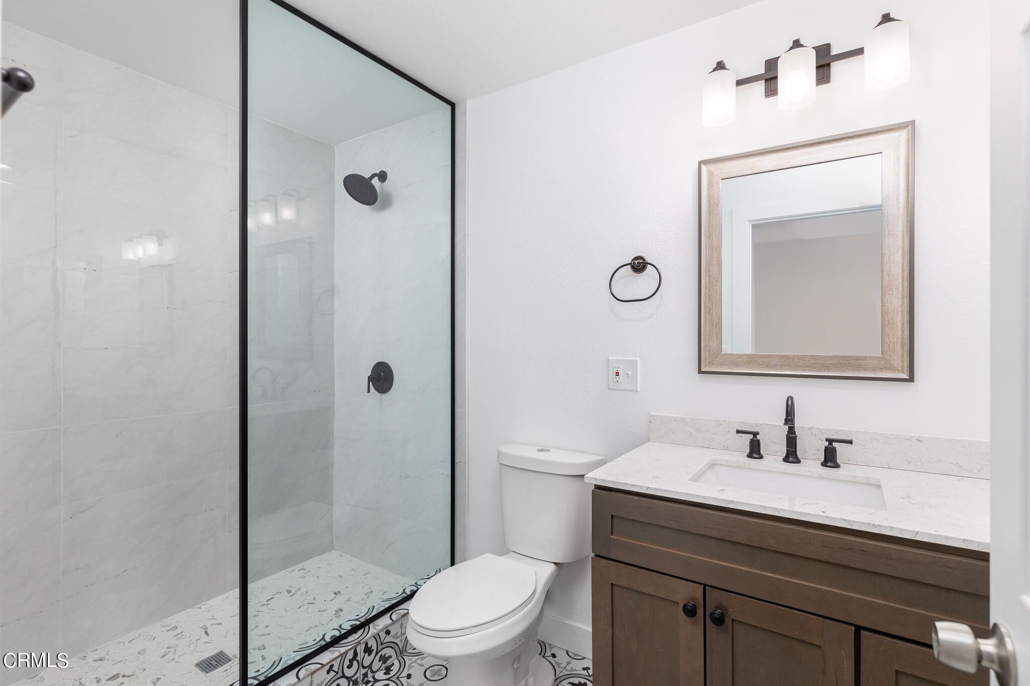 2485 Hanning Avenue Altadena, CA 91001 - Photo 12 of 36 a bathroom with a toilet a sink a glass door a shower and a mirror