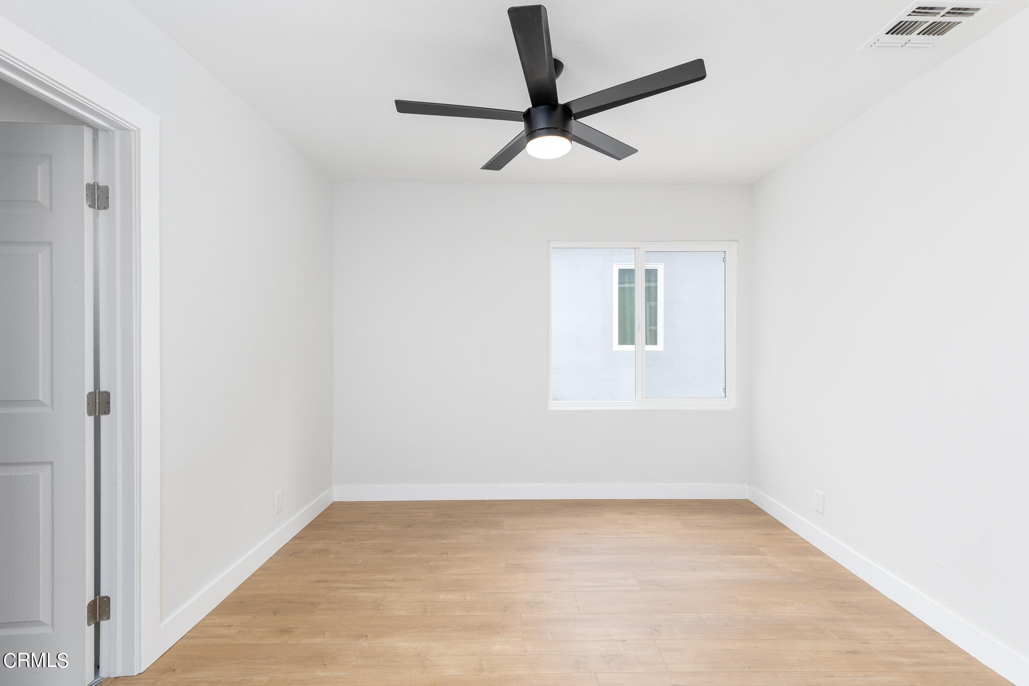 2485 Hanning Avenue Altadena, CA 91001 - Photo 14 of 36 a view of a room with a ceiling fan and a window