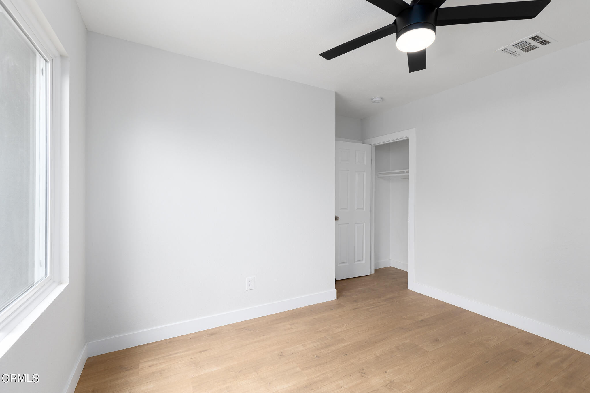 2485 Hanning Avenue Altadena, CA 91001 - Photo 15 of 36 an empty room with a window and a ceiling fan