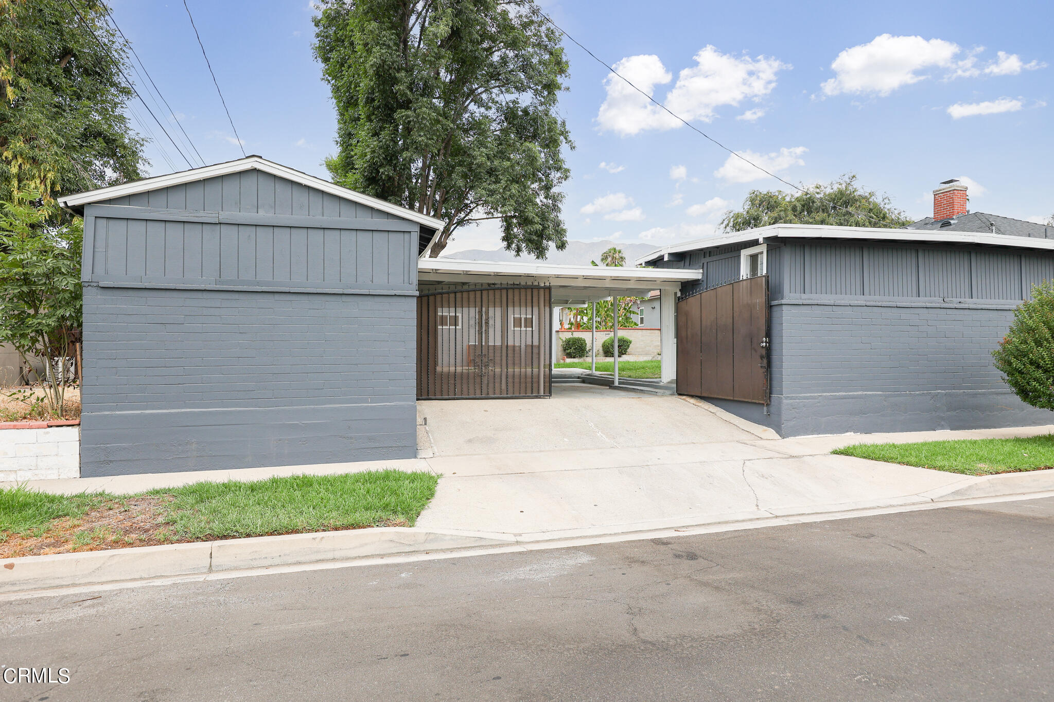 2485 Hanning Avenue Altadena, CA 91001 - Photo 31 of 36 a front view of a house with a yard and garage