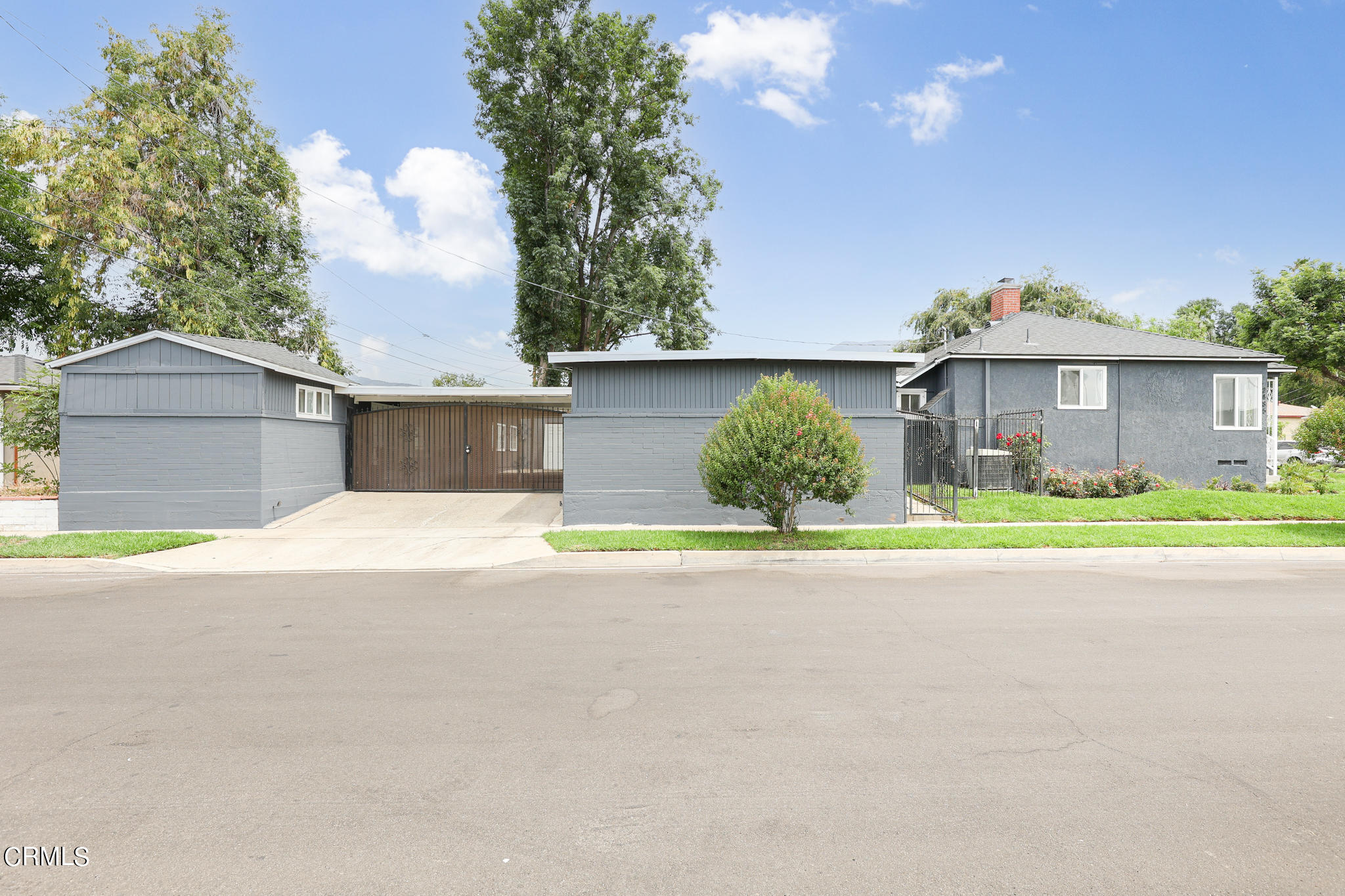 2485 Hanning Avenue Altadena, CA 91001 - Photo 32 of 36 a front view of a house with a garden and a garage