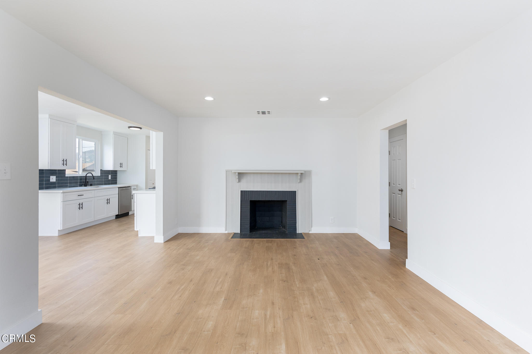 2485 Hanning Avenue Altadena, CA 91001 - Photo 5 of 36 a view of an empty room with a fireplace and a window